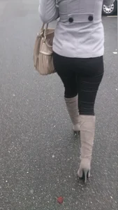 Girl in Leggings And Stiletto Knee-High Boots Street Creepshot