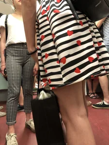 Girl in Striped Dress with Hearts Pattern Skinny Legs Subway Closeup Creepshot