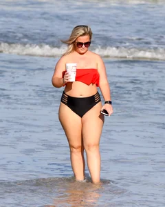 Thick BBW blonde lady in a bikini at the beach