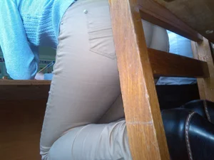 Candid College Teen in Beige Tight Pants Standing on Her Knees on a Chair And Bending Over Creepshots