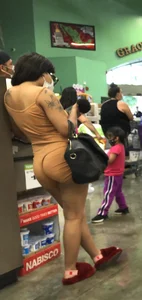 Latina with hard nipples and a big booty in tight spandex shorts outfit