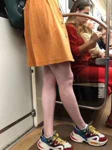 Cute Teen Girl in a Dress With Slim Legs Standing in the Subway Train, Then Crossing the Street Photo Gallery