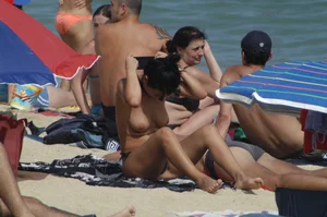 Topless girls on a beach in Barcelona