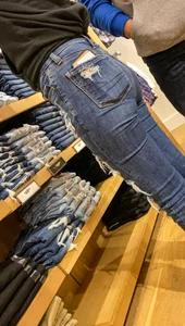 Teen in tight jeans looks to buy another pair