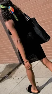 Sexy braless ebony babe in tight skirt with pokies