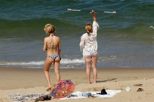 Sexy mix of girls in bikinis at the beach
