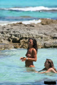 Nude beach ladies in the water showing their tits