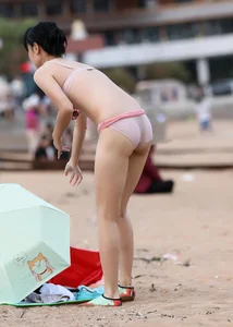 Beach Asian with camel toe and sexy body in bikini