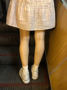 Cute Girl in a Dress with Thin Hot Legs Standing on the Subway Escalator Closeup Creepshots Gallery