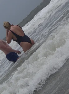 Thick blonde on the beach with a big booty in a blue swimsuit