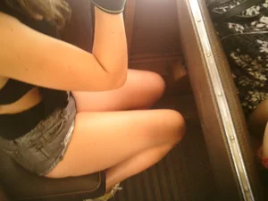 Sexy girl on the bus in jean shorts with nice legs and cleavage