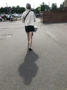 Cute candid teen with pale slim legs in shorts