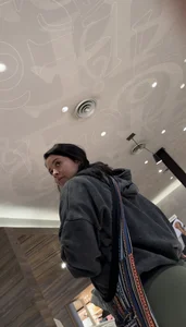 Sexy bubble butt in tight green leggings at the mall