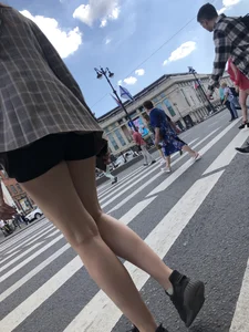 Closeups of a gorgeous girl wearing spandex mini shorts crossing the street