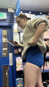 Stunning cheeked up gym girl shopping in blue shorts (OC)