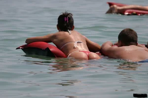 Beach voyeur girls in bikinis, thongs and topless