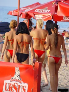 Beach voyeur girls in bikinis, thongs and topless