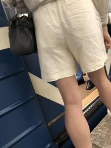 Subway hottie wearing shorts