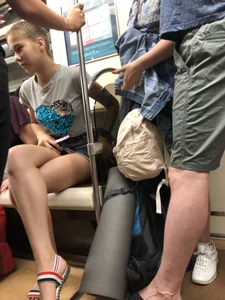 Tall Candid Teen Girl in Denim Shorts And Sandals Sitting in the Subway Train, Then Walking Down the Station