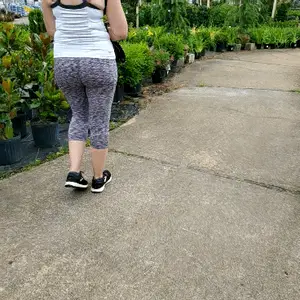 Milf booty in tight leggings shopping for plants