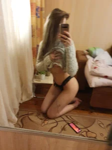 Cute Girl in Panties Pulling Up Sweater in front of the Mirror Bedroom Selfie