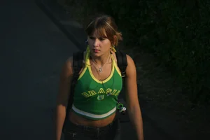 Pretty girl playing tennis in a skirt and walking in jeans