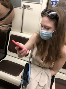 Cute Girl With Long Wavy Hair in a Mask Subway Train Photos - Candid Downblouse
