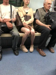 Very Skinny Girl Wearing Glasses with Long Legs in a Short Skirt Falling Asleep in a Subway Train Candid