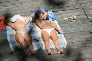 Two teens stripping and going topless to tan
