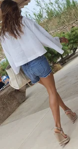 Flat ass leggy girl in denim shorts