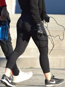 Brunette walking in leggings with a thick booty and showing some camel toe