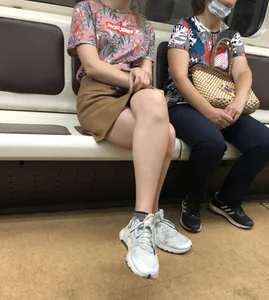 Amazing Hot Girl in a Skirt and Sneakers Sitting Cross-Legged in the Subway Train and on the Escalator Candid Photos Gallery