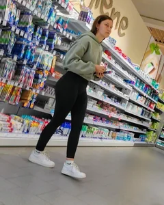 Slim girl with good body in black leggings