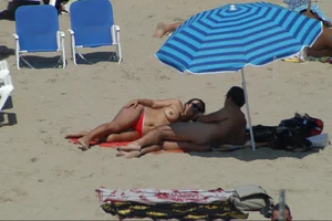 Girls on a nude beach in Sitges, Spain