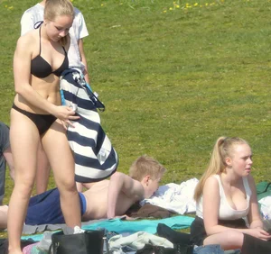Teen taking off her dress in the park