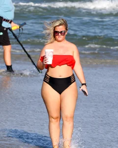 Thick BBW blonde lady in a bikini at the beach