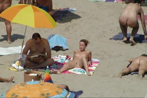 Girls on a nude beach in Sitges, Spain