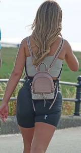 Blonde woman in lycra shorts - good front view, back view ruined by a bag