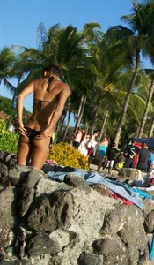 Beach shower girl with cute little ass in tiny black bikini