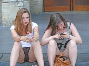 Girls in Shorts Sitting on Pavement Street Creepshot