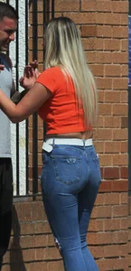 Blonde in skintight jeans shopping with boyfriend