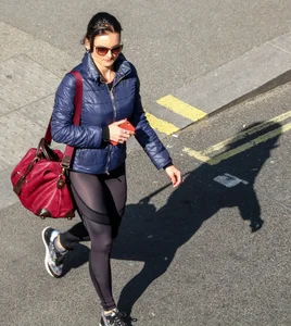 Brunette lady in leggings out walking