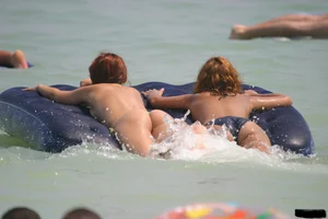 A bunch of sexy beach voyeur babes in bikinis, thongs and topless