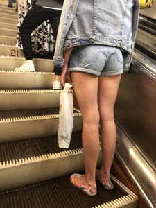 Girl in Blue Denim Shorts and with Hot Long Legs Subway Escalator Creepshot
