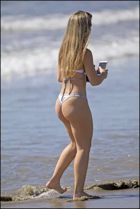Two hot and sexy girls on the beach in thongs with incredible asses