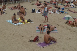 Topless girls on a beach in Barcelona
