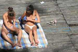 Two teens stripping and going topless to tan