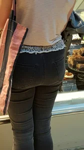 Petite ass and slim legs in tight black jeans
