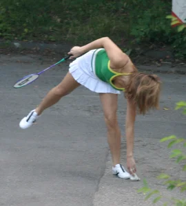 Pretty girl playing tennis in a skirt and walking in jeans