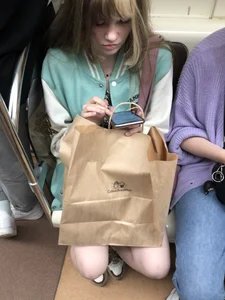 Cute Teen Girl in a Skirt And Sneakers With Very Pale Skin, Candid Photos in Subway